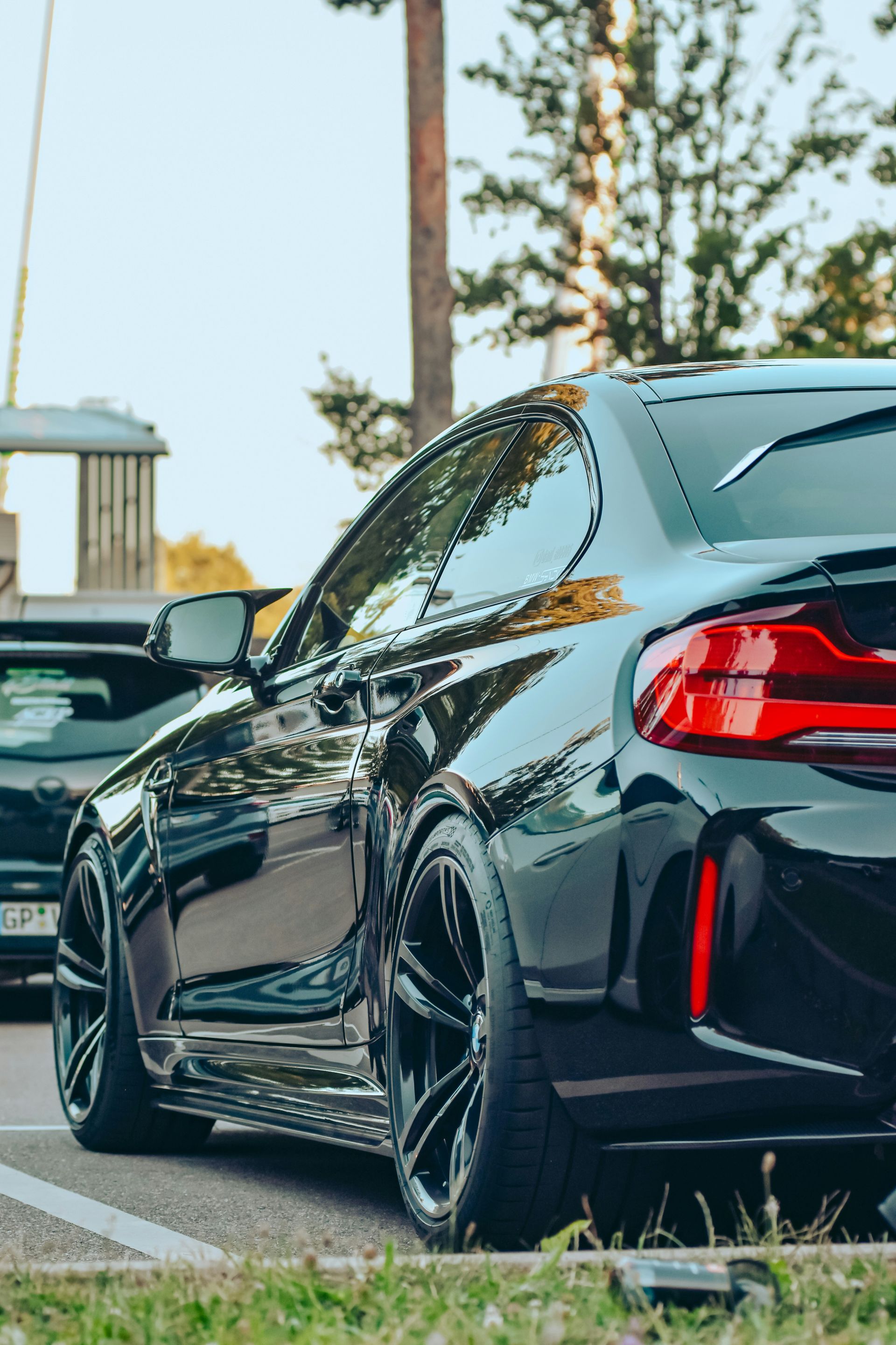 a black car parked on the side of the road